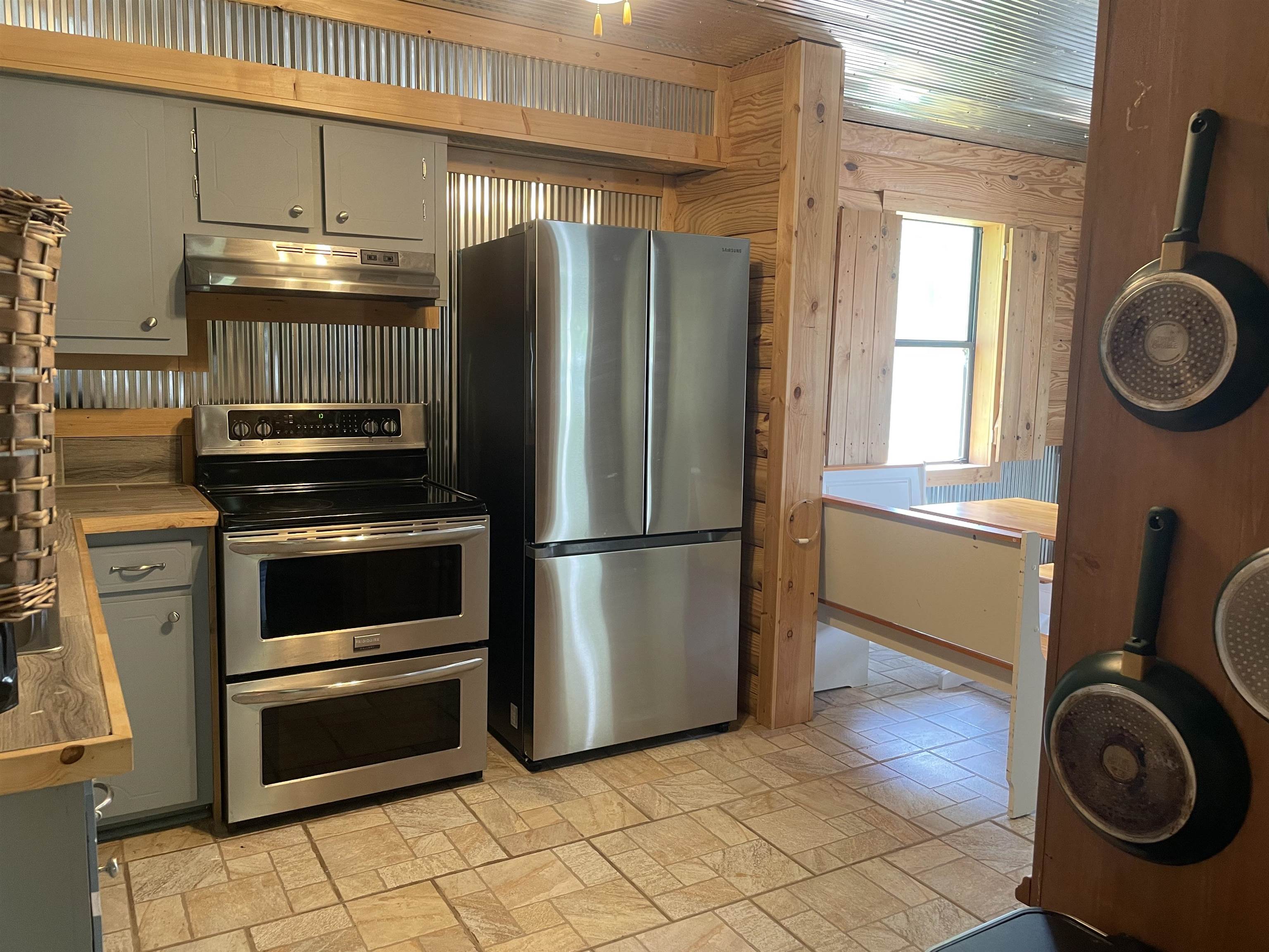 2349 Snyder Bluff Road Ripley, TN 38063 - Photo 7 of 21 Kitchen featuring stainless steel appliances and gray cabinetry