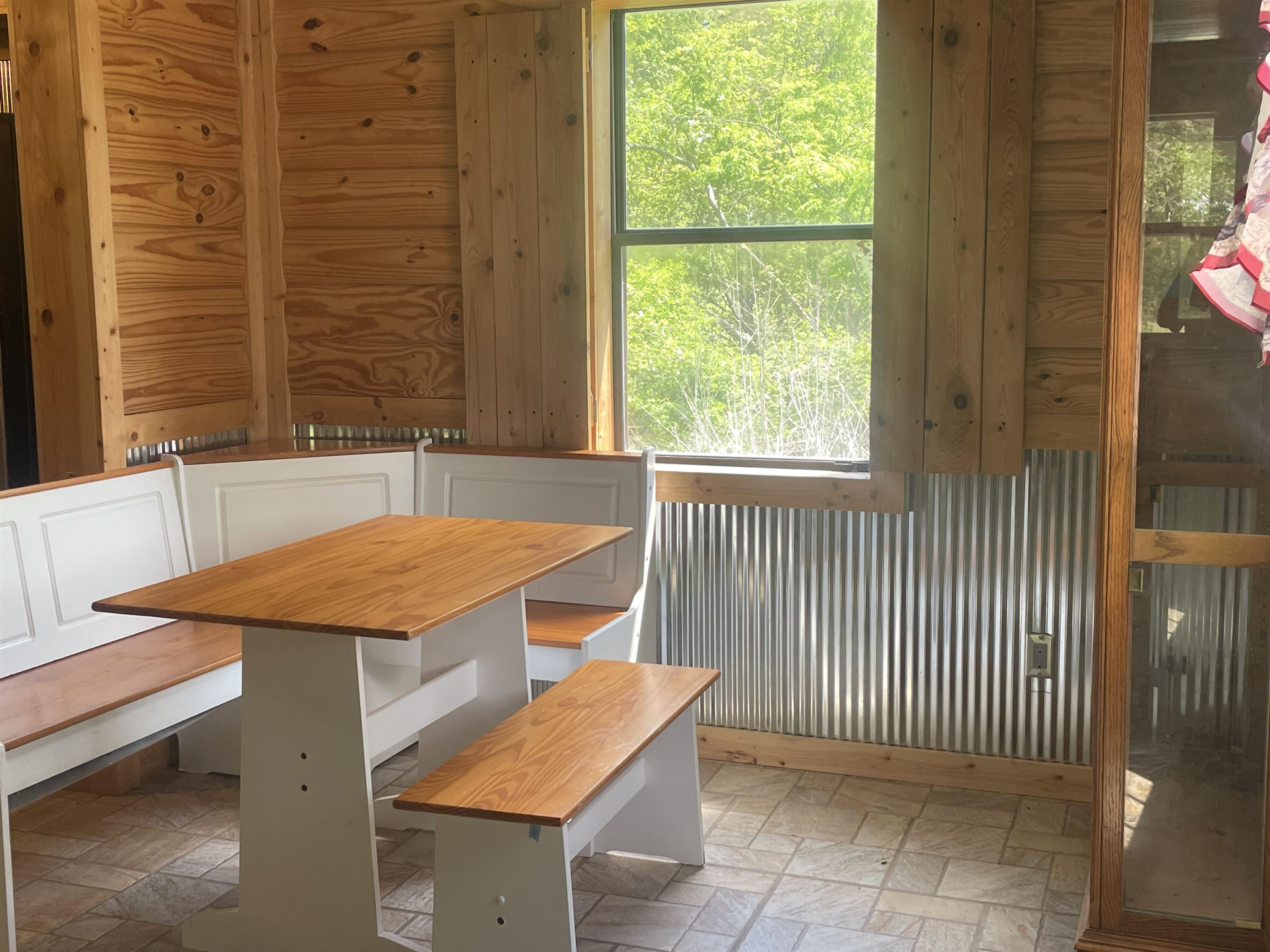 2349 Snyder Bluff Road Ripley, TN 38063 - Photo 10 of 21 Unfurnished dining area with stone tile floors