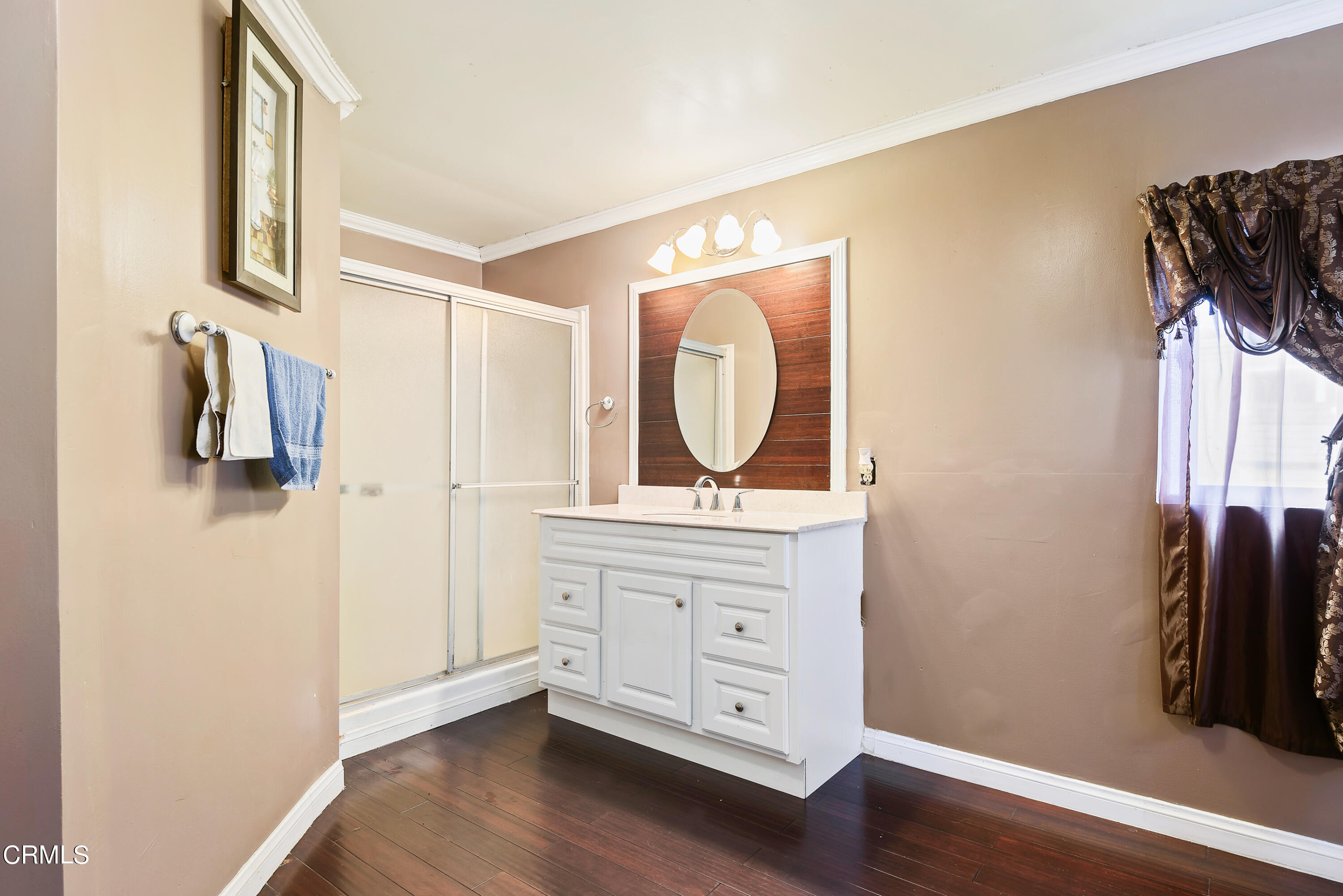 140 Rainbow Drive, Unit 162 Oxnard, CA 93033 - Photo 11 of 19 a bedroom with a bed and a mirror on the dresser