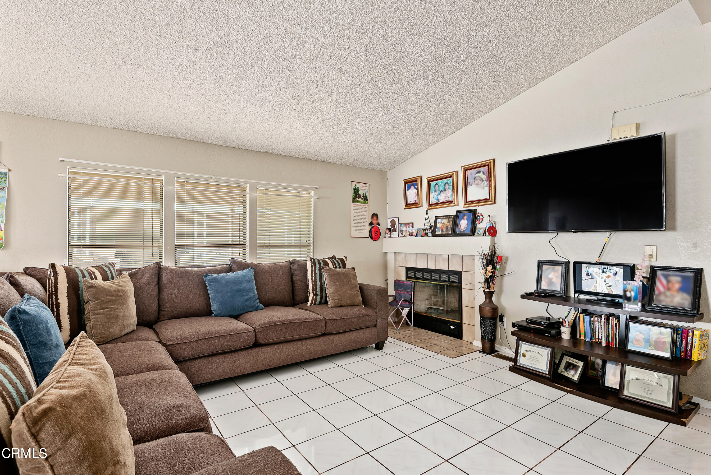 140 Rainbow Drive, Unit 162 Oxnard, CA 93033 - Photo 4 of 19 a living room with furniture and a flat screen tv