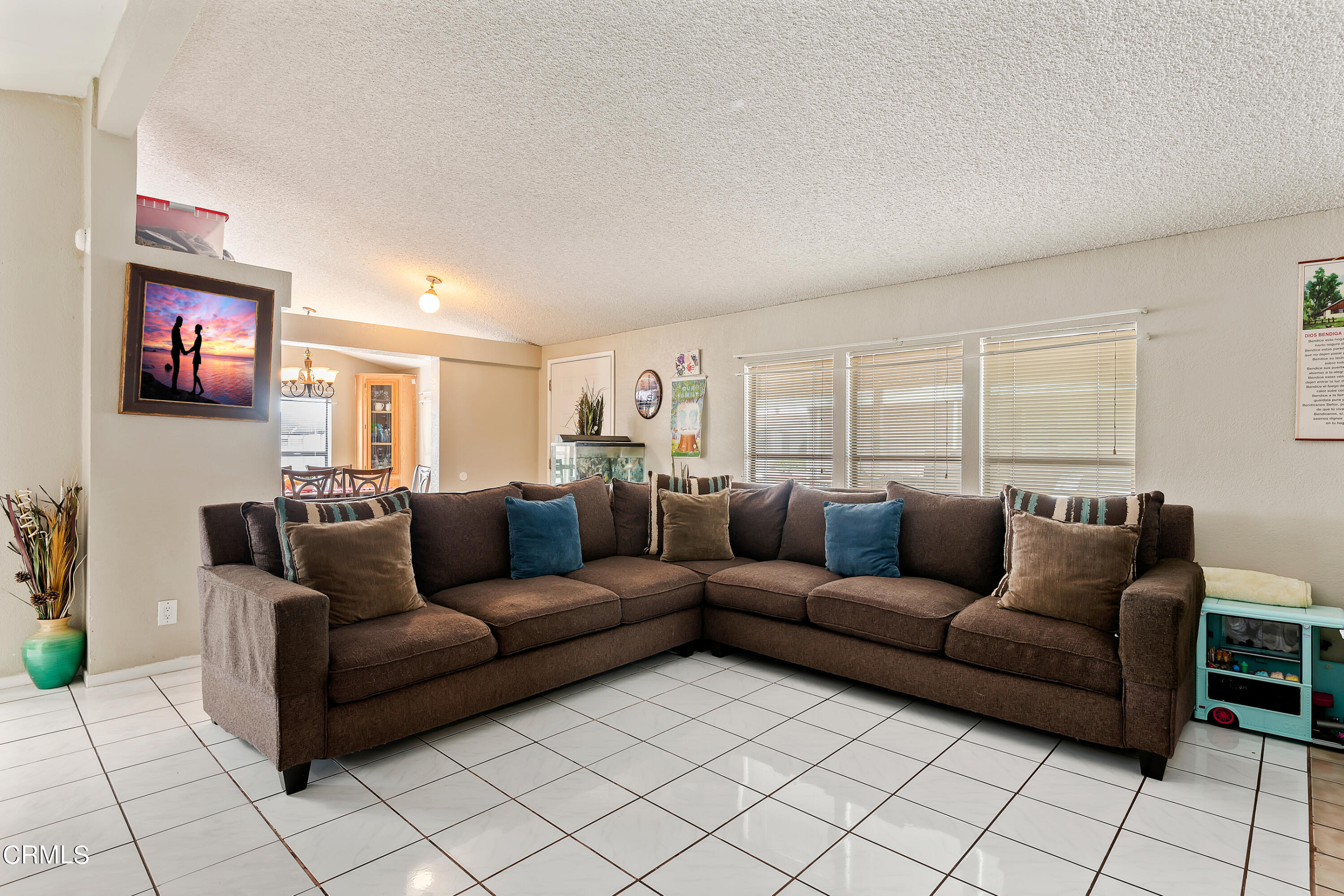 140 Rainbow Drive, Unit 162 Oxnard, CA 93033 - Photo 5 of 19 a living room with furniture and a flat screen tv