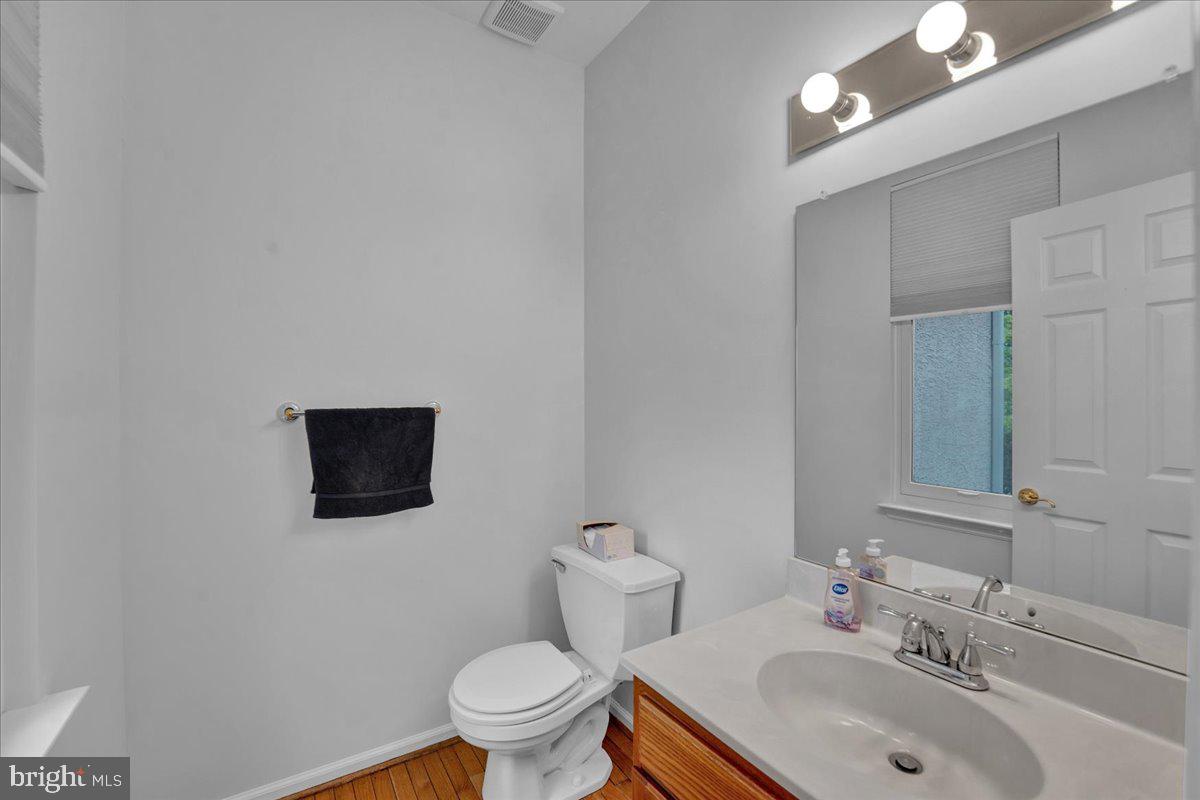 550 Betcher Road Trappe, PA 19426 - Photo 12 of 71 a bathroom with a toilet sink and mirror