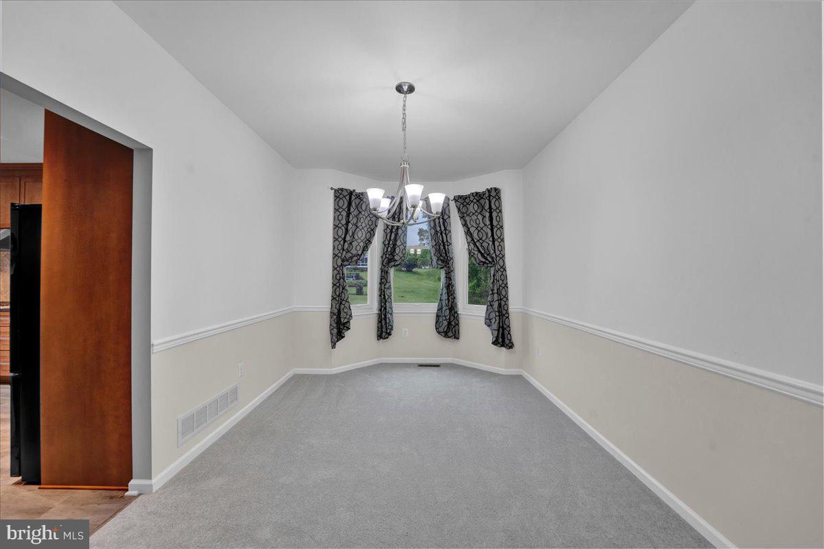 550 Betcher Road Trappe, PA 19426 - Photo 13 of 71 a view of an empty room with window and chandelier