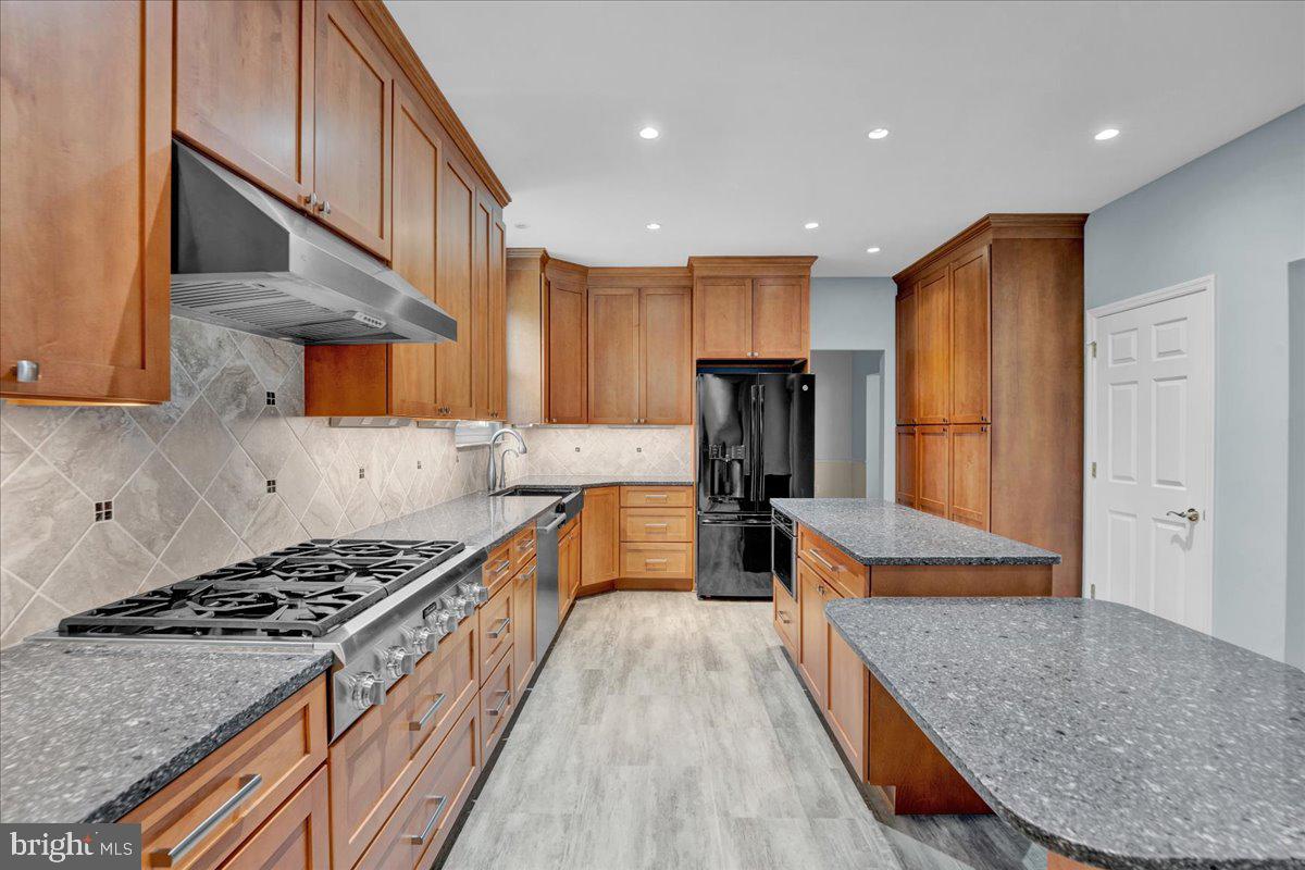 550 Betcher Road Trappe, PA 19426 - Photo 19 of 71 a kitchen with stainless steel appliances granite countertop a stove a refrigerator and a sink