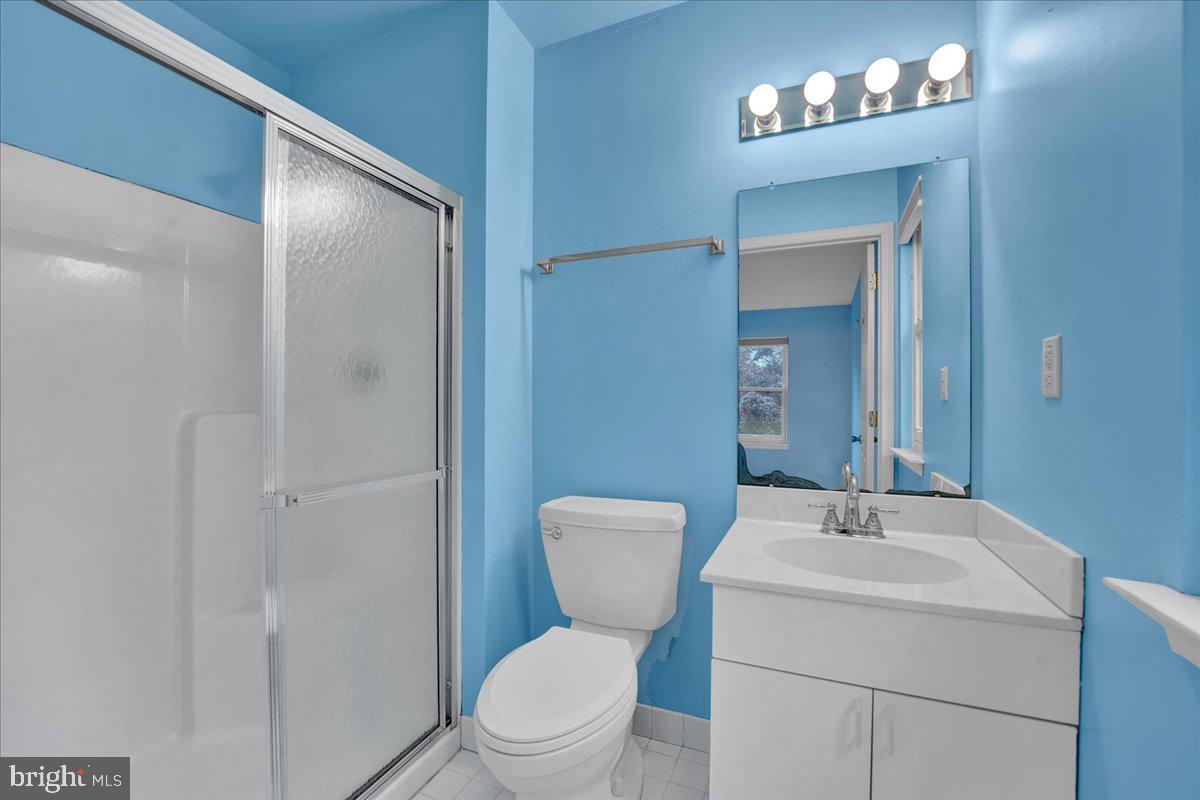 550 Betcher Road Trappe, PA 19426 - Photo 37 of 71 a bathroom with a toilet a sink and mirror
