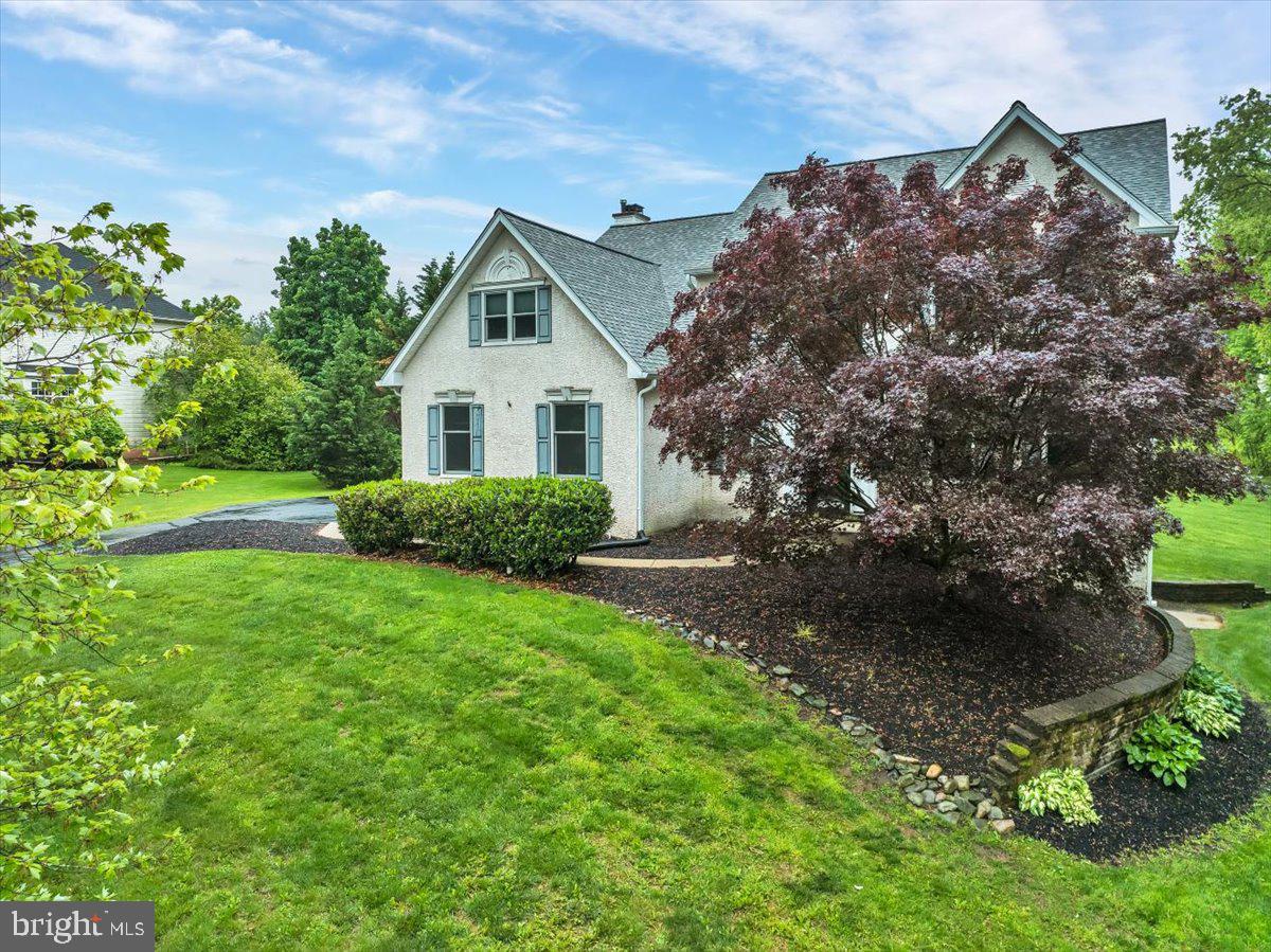 550 Betcher Road Trappe, PA 19426 - Photo 5 of 71 a front view of a house with garden