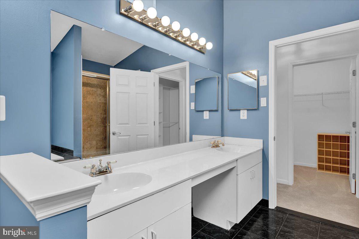 550 Betcher Road Trappe, PA 19426 - Photo 52 of 71 a bathroom with a sink and a mirror