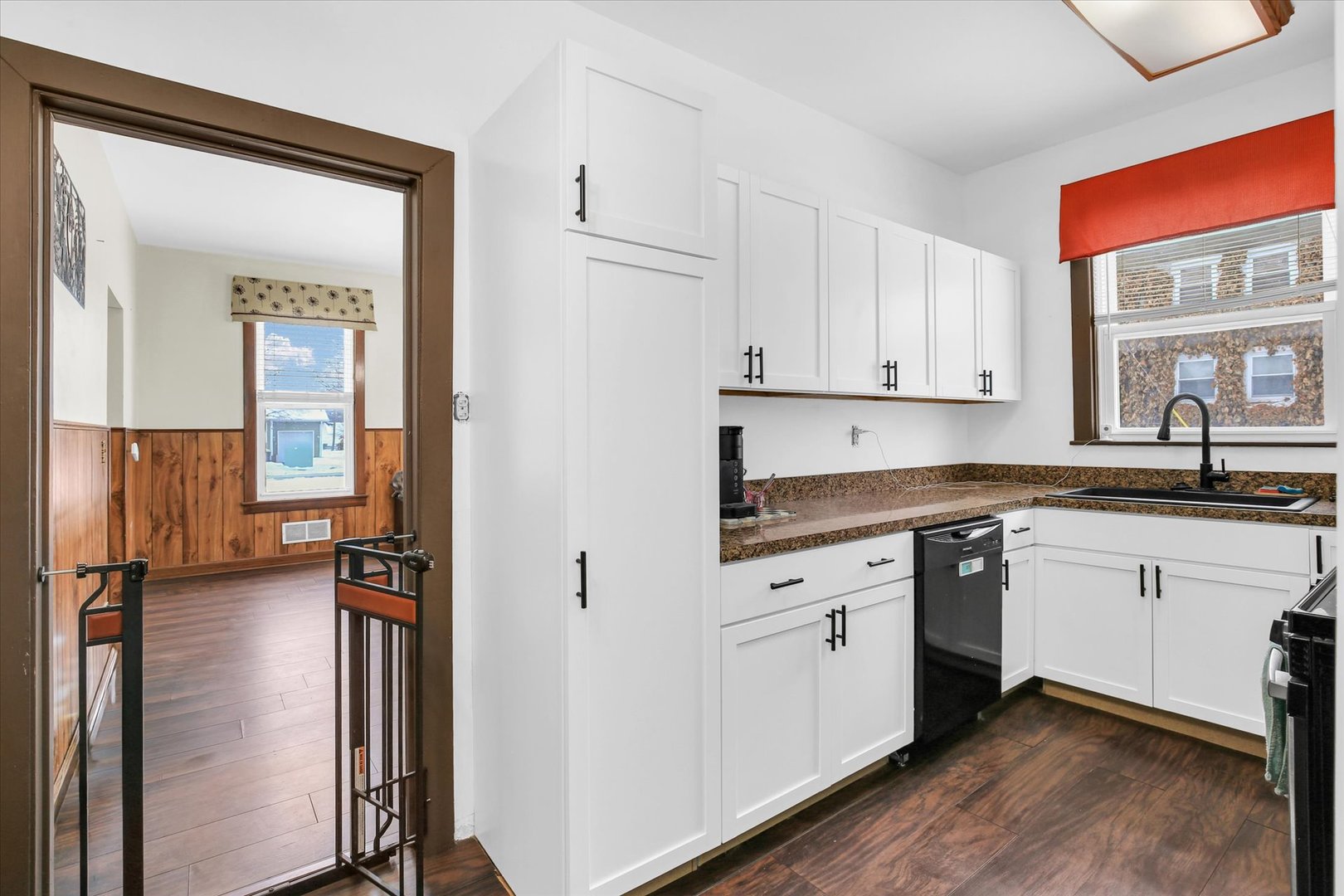 110 East Barker Street Tuscola, IL 61953 - Photo 12 of 32 a kitchen with a refrigerator and a sink