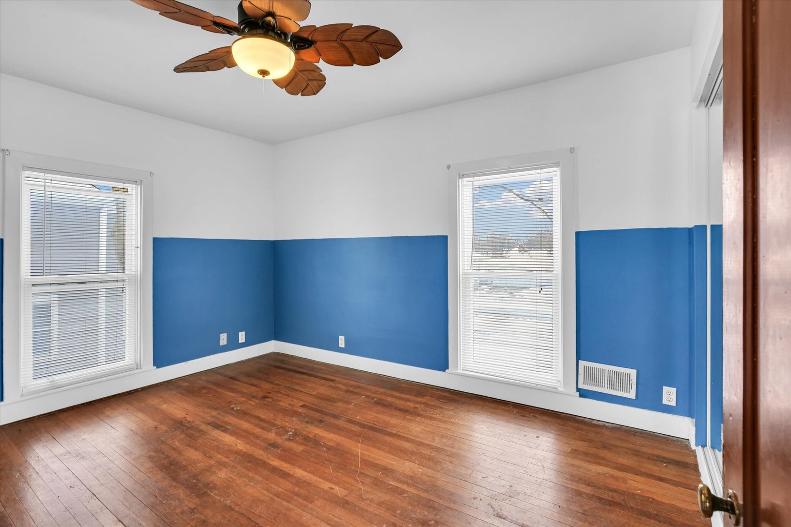 110 East Barker Street Tuscola, IL 61953 - Photo 20 of 32 an empty room with wooden floor closet and windows