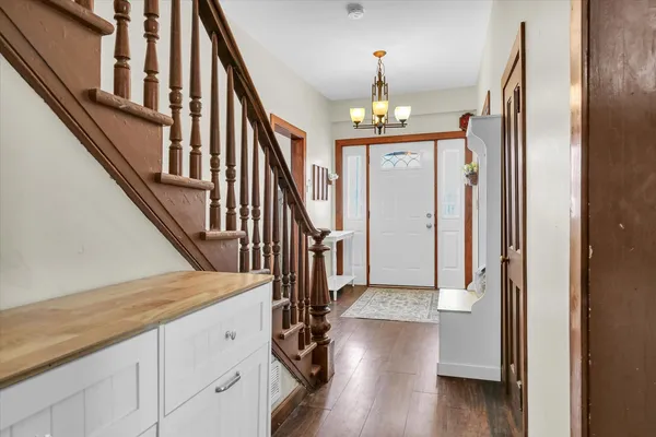 a view of staircase with wooden floor and staircase