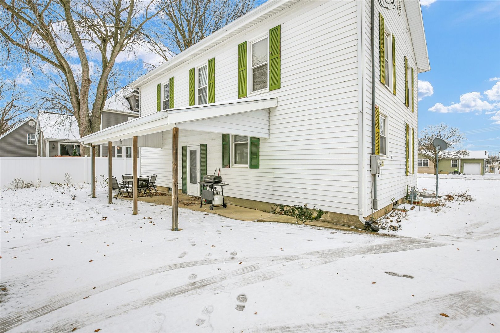 110 East Barker Street Tuscola, IL 61953 - Photo 29 of 32 a view of a house with a snow on the road