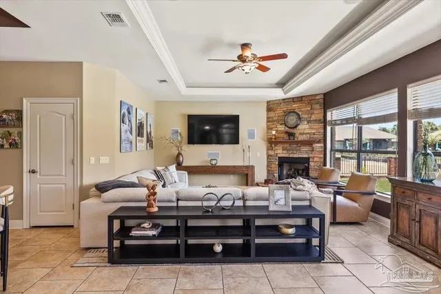 a living room with furniture fireplace and a flat screen tv