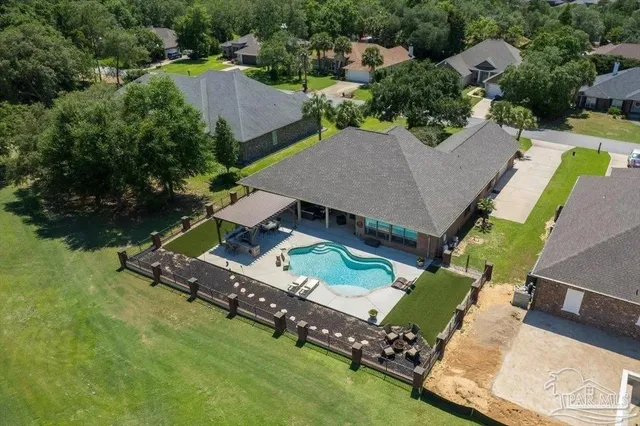 a front view of a house with a garden and patio
