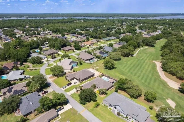 an aerial view of a house with outdoor space
