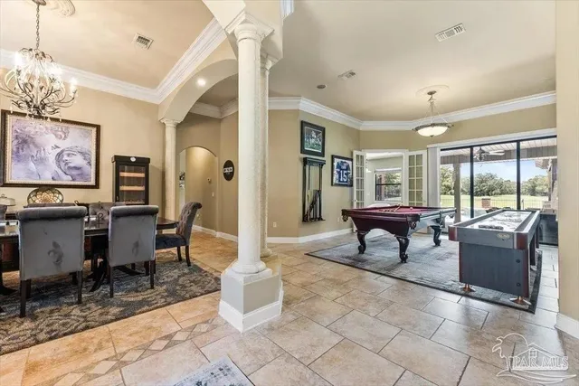 a living room with furniture a rug and a large window