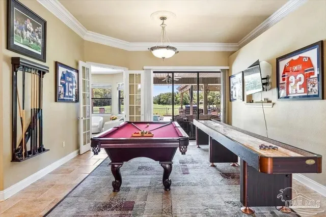 a room with furniture pool table and flat screen tv
