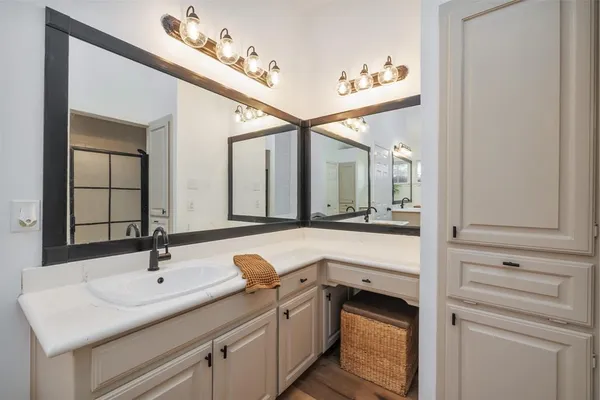 a bathroom with a sink and a mirror