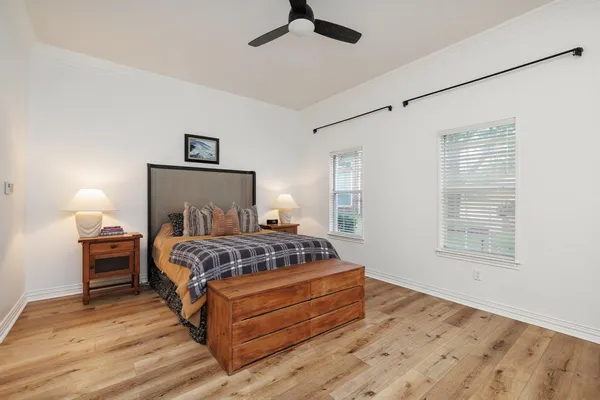 a bedroom with a bed and window