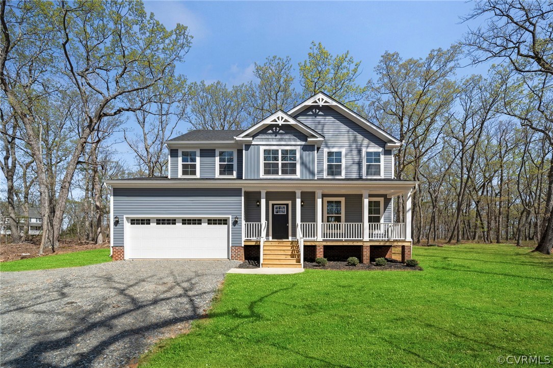 84 Proffits Road Louisa, VA 23093 - Photo 1 of 19 a front view of a house with a yard and trees