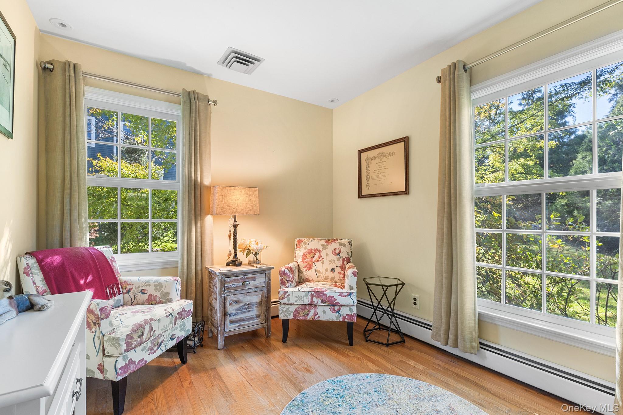 7 Byram Meadows Road Armonk, NY 10504 - Photo 13 of 32 a bedroom with furniture and a window
