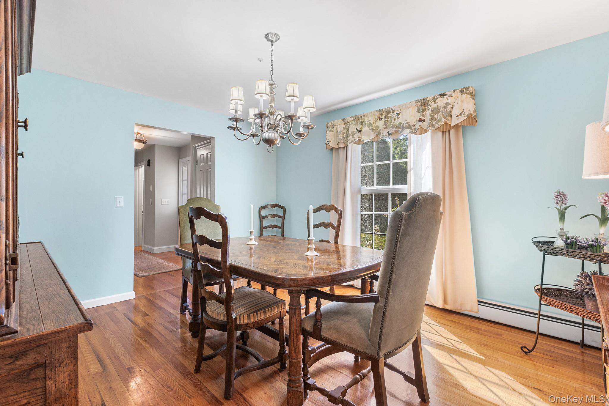 7 Byram Meadows Road Armonk, NY 10504 - Photo 15 of 32 a view of a dining room with furniture window and wooden floor