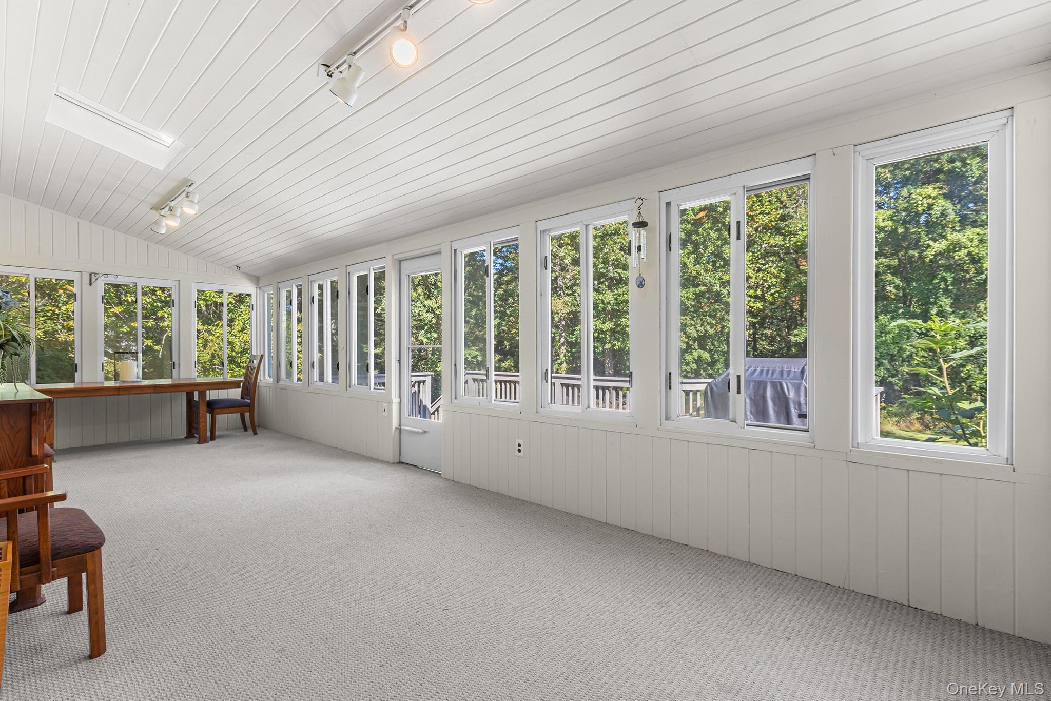7 Byram Meadows Road Armonk, NY 10504 - Photo 16 of 32 a view of an empty room with a window and balcony