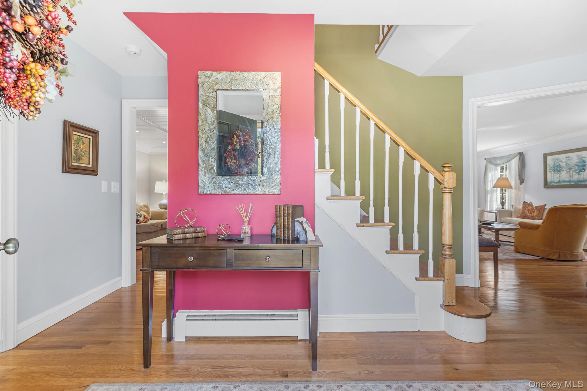 7 Byram Meadows Road Armonk, NY 10504 - Photo 18 of 32 a view of entryway dining room and hall with wooden floor