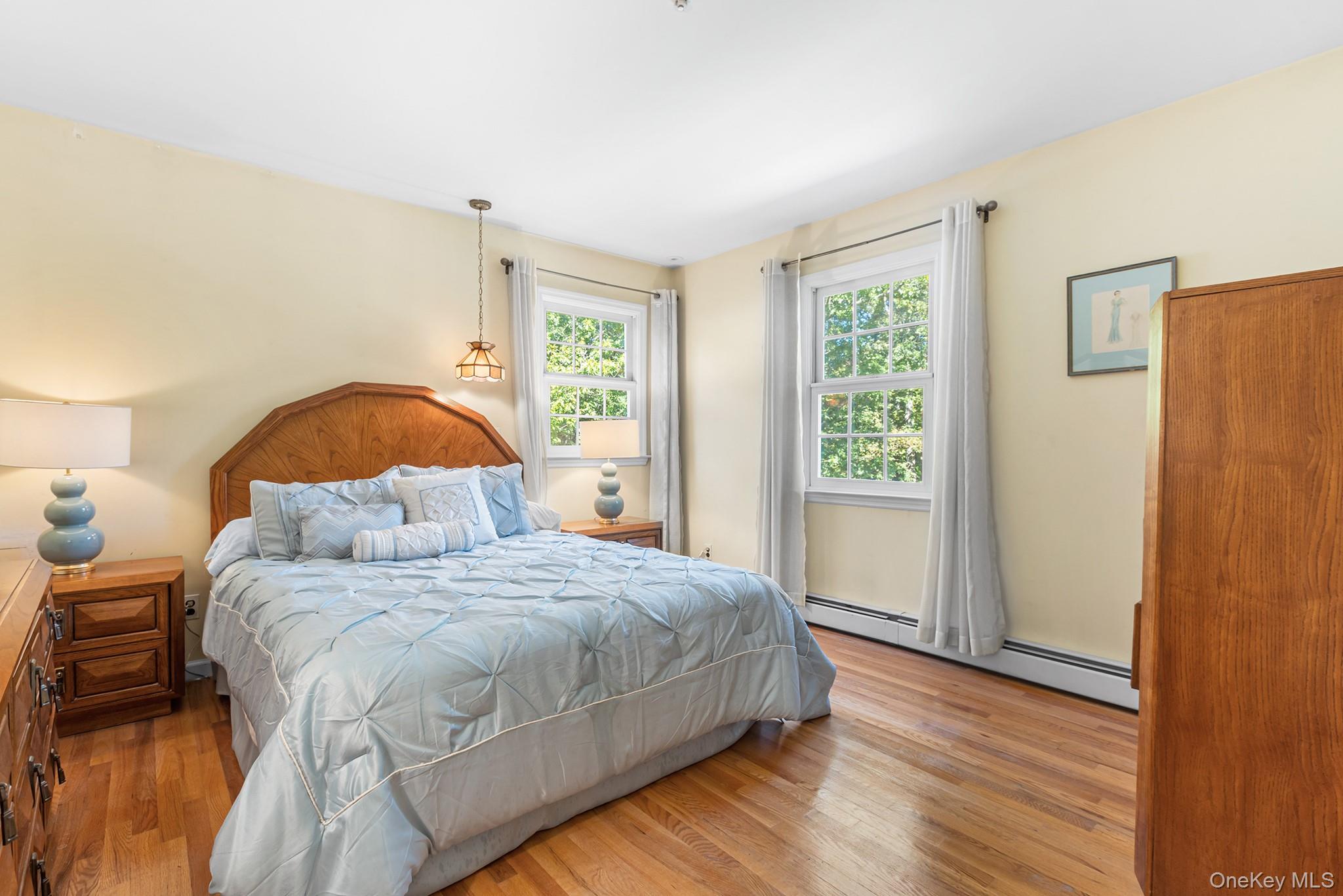 7 Byram Meadows Road Armonk, NY 10504 - Photo 20 of 32 a bedroom with a bed and a window