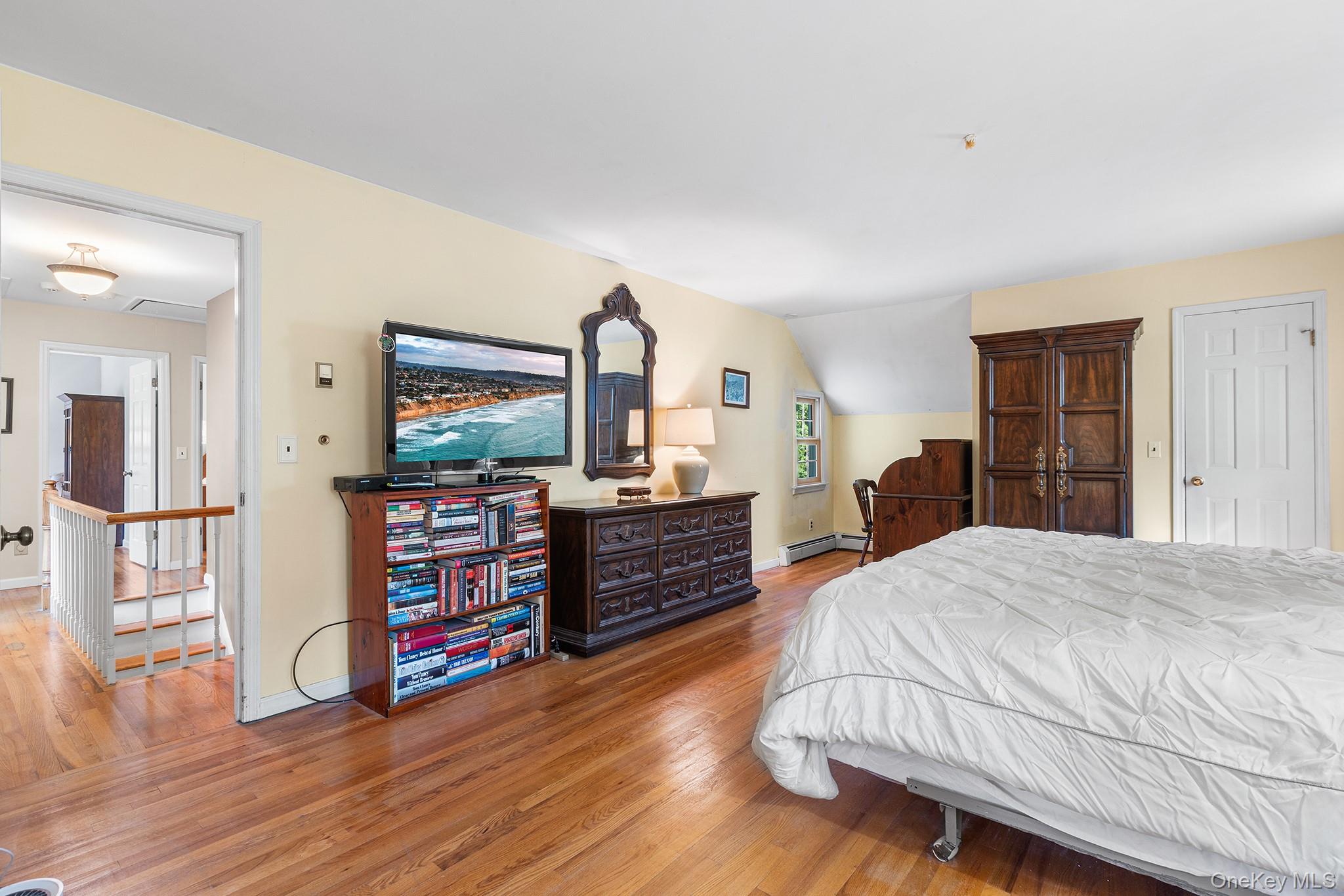 7 Byram Meadows Road Armonk, NY 10504 - Photo 23 of 32 a bed room with furniture and a flat screen tv