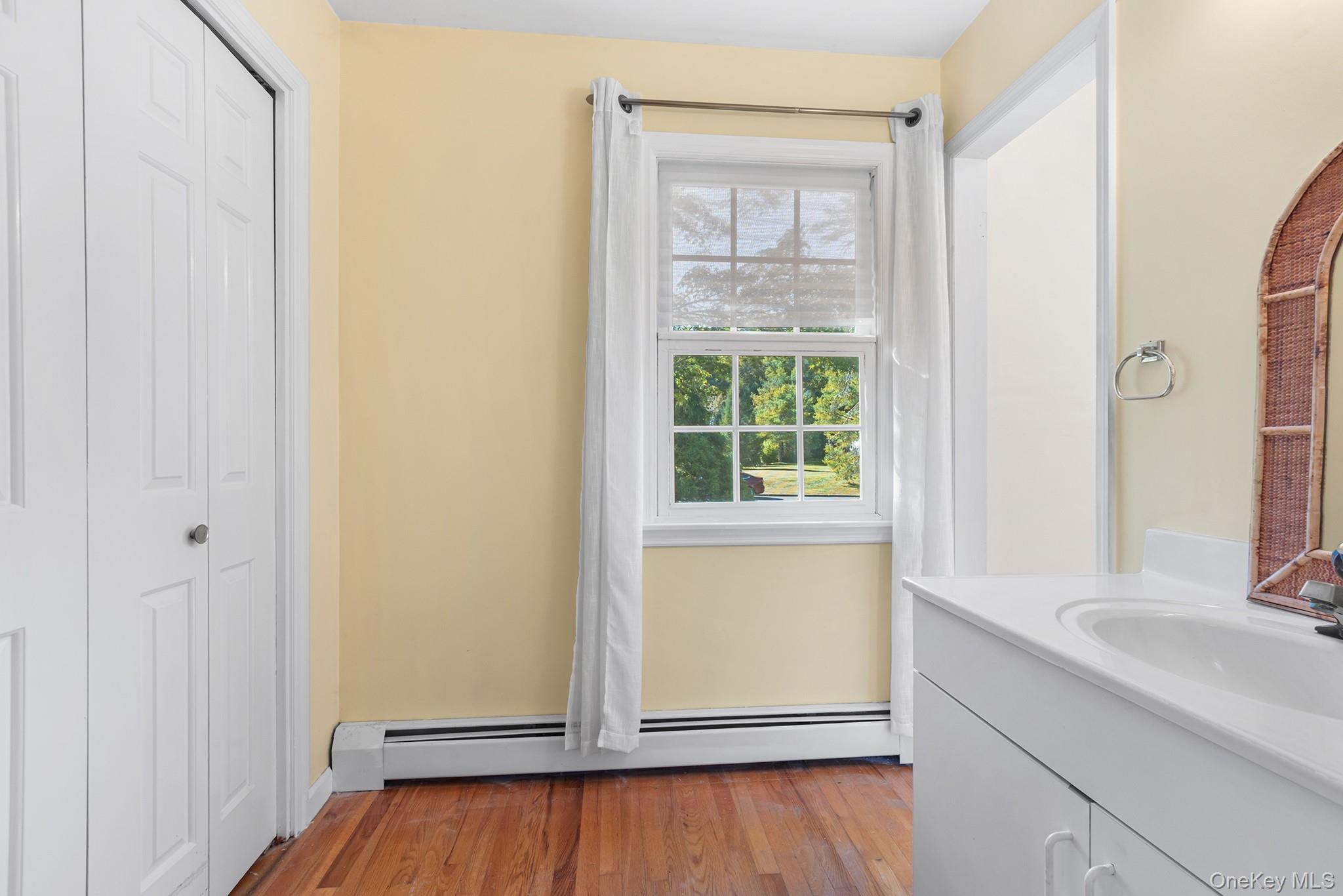 7 Byram Meadows Road Armonk, NY 10504 - Photo 24 of 32 a bathroom with a sink and a bathtub