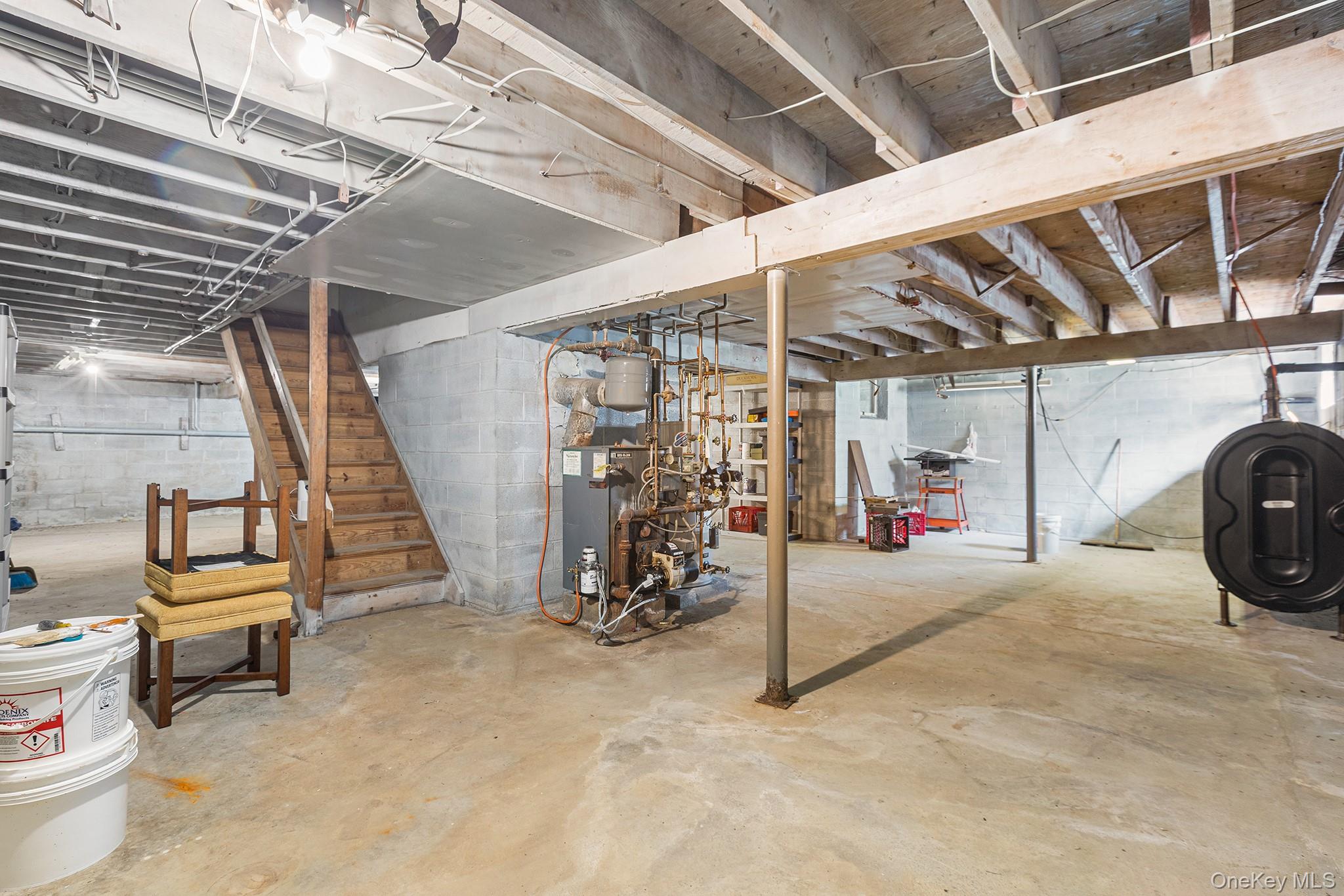 7 Byram Meadows Road Armonk, NY 10504 - Photo 26 of 32 a view of a garage with wooden table and chairs