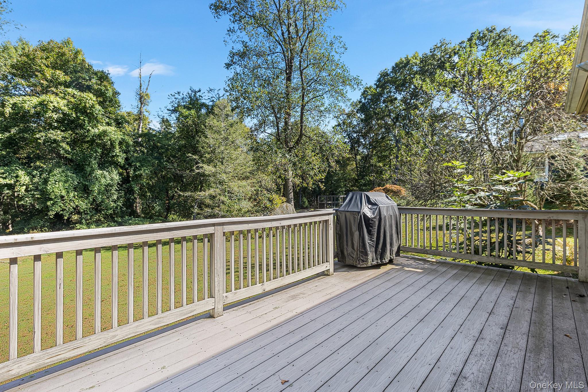 7 Byram Meadows Road Armonk, NY 10504 - Photo 27 of 32 a view of balcony with wooden floor and fence