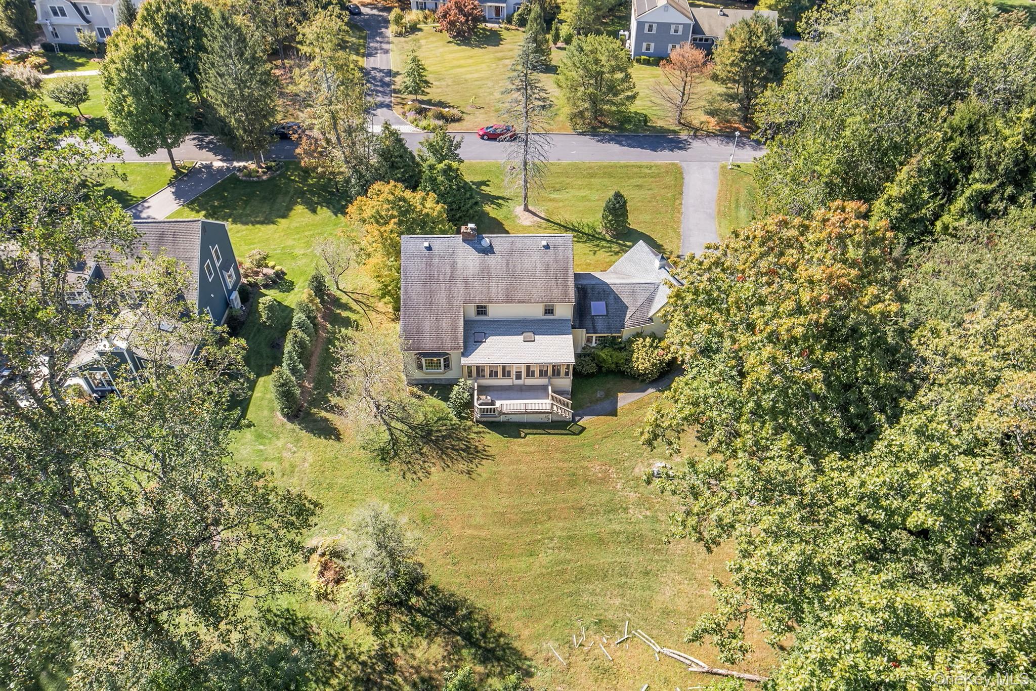 7 Byram Meadows Road Armonk, NY 10504 - Photo 29 of 32 a view of a house with a yard