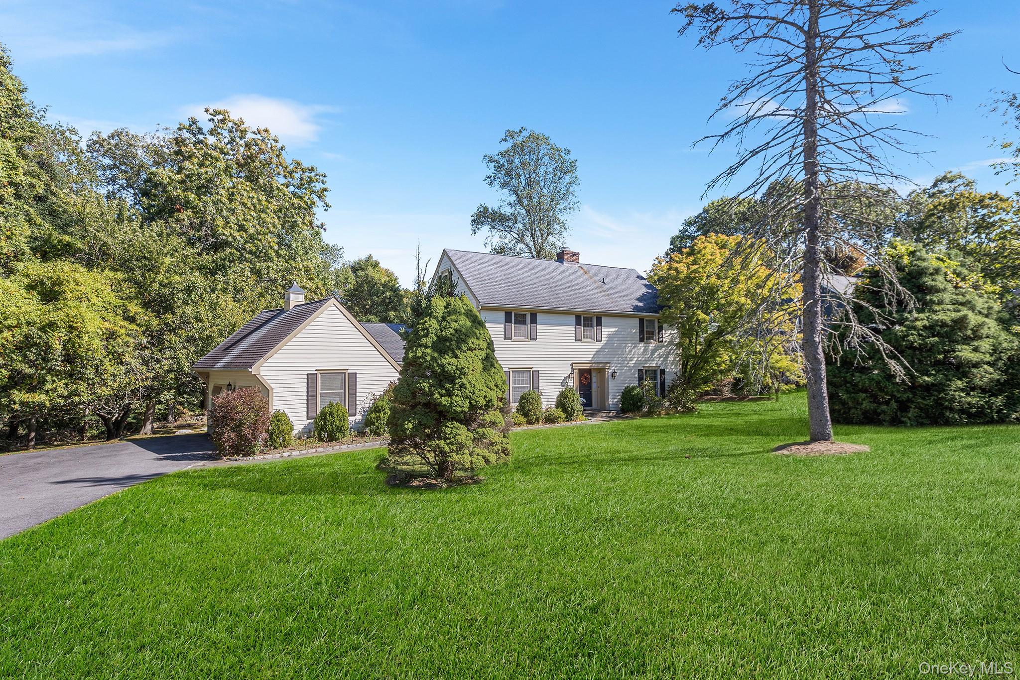 7 Byram Meadows Road Armonk, NY 10504 - Photo 30 of 32 a front view of a house with garden