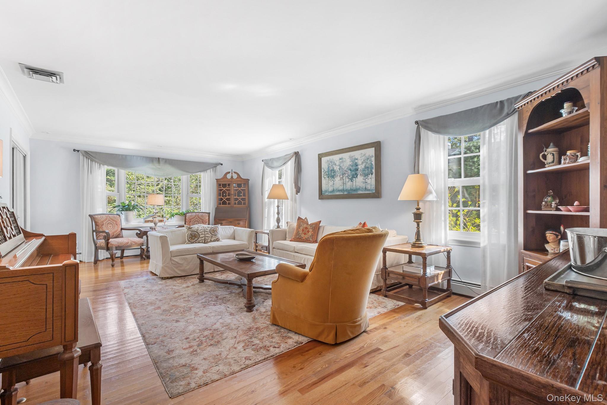 7 Byram Meadows Road Armonk, NY 10504 - Photo 5 of 32 a living room with furniture and large windows
