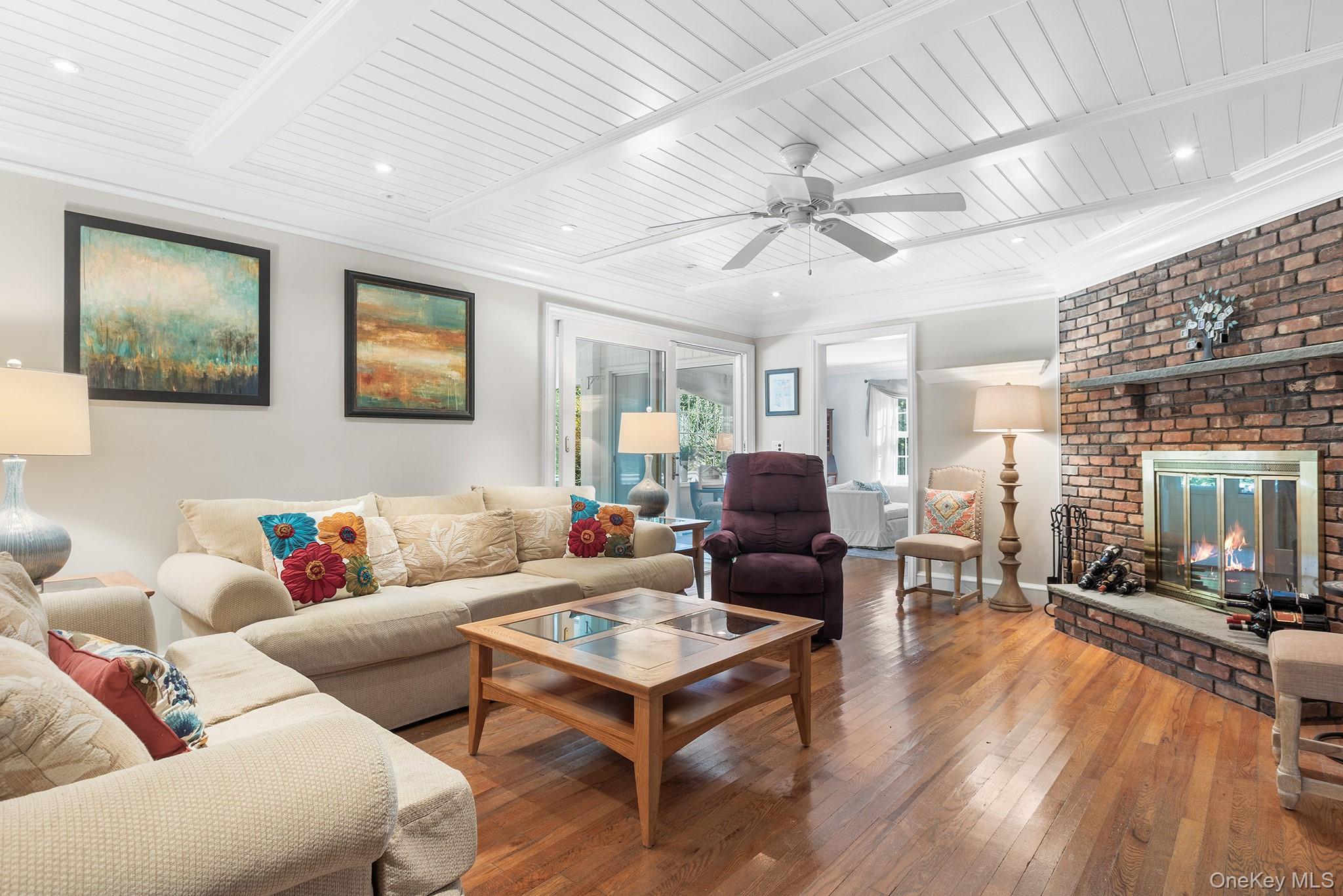 7 Byram Meadows Road Armonk, NY 10504 - Photo 6 of 32 a living room with furniture a ceiling fan and a rug