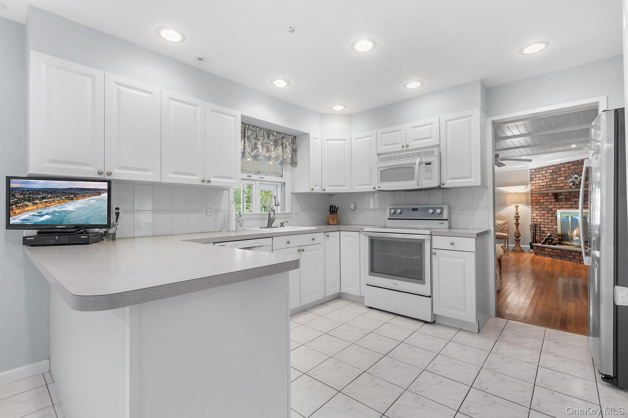 7 Byram Meadows Road Armonk, NY 10504 - Photo 9 of 32 a kitchen with a sink cabinets and appliances