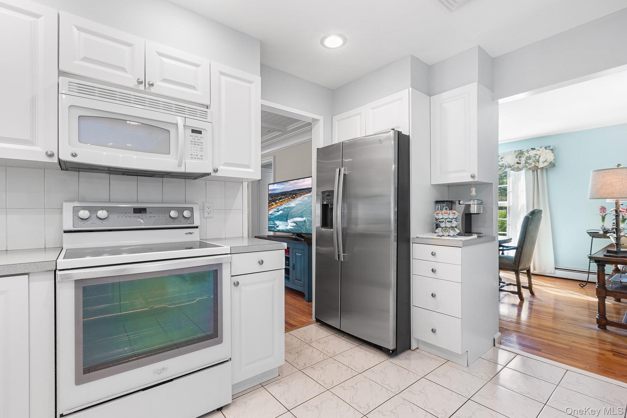 7 Byram Meadows Road Armonk, NY 10504 - Photo 10 of 32 a kitchen with cabinets stainless steel appliances and a counter top space