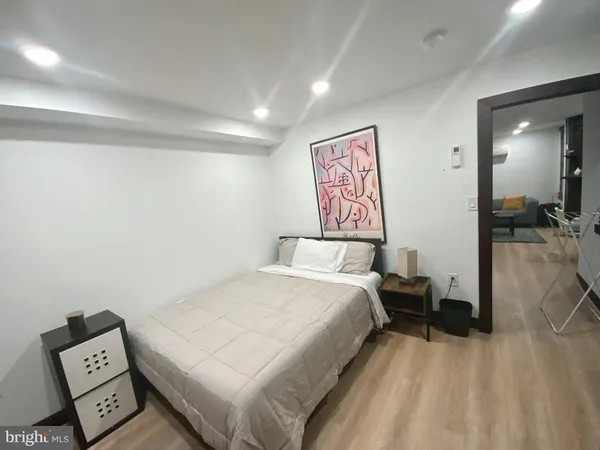 a bedroom with a bed and a view of bathroom