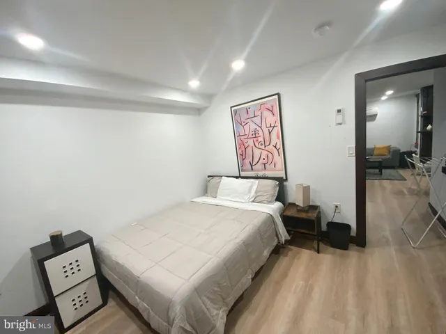 a bedroom with a bed and a view of bathroom