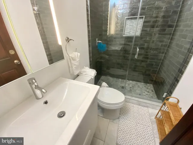 a bathroom with a sink and toilet