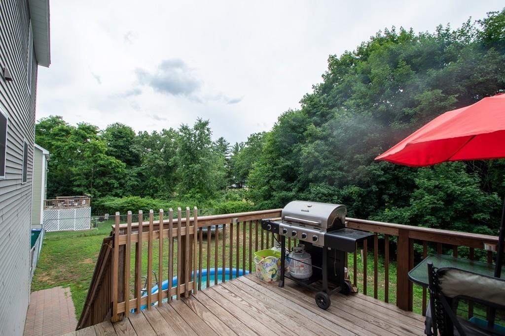 70 Frederick Street Fitchburg, MA 01420 - Photo 18 of 19 a balcony with wooden floor table and chairs