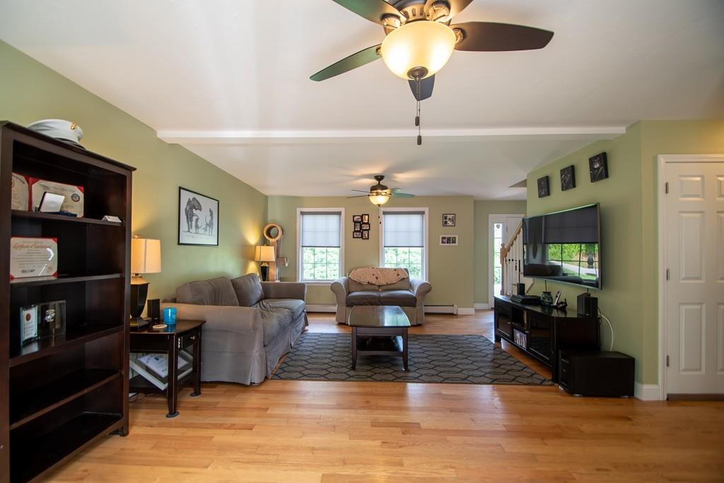 70 Frederick Street Fitchburg, MA 01420 - Photo 6 of 19 a living room with furniture and a flat screen tv
