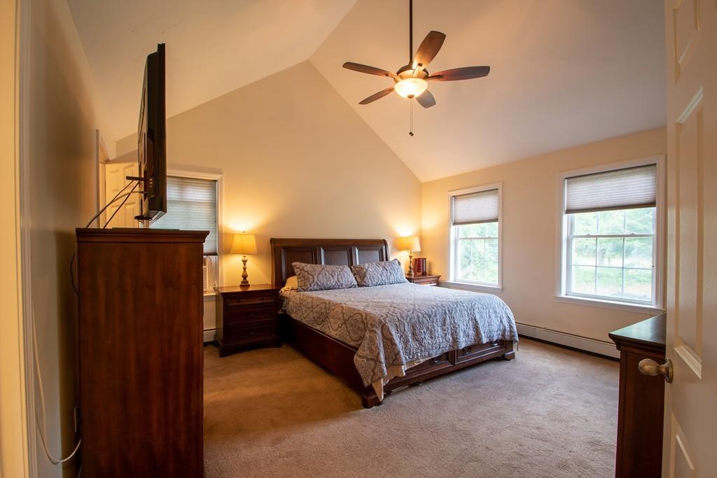 70 Frederick Street Fitchburg, MA 01420 - Photo 10 of 19 a bedroom with a bed window and a chandelier
