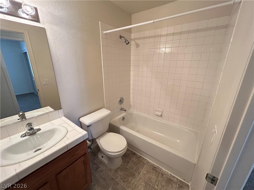 1840 Montvale Las Vegas, NV 89134 - Photo 17 of 31 Functional bathroom featuring a shower-tub combination and a single vanity.