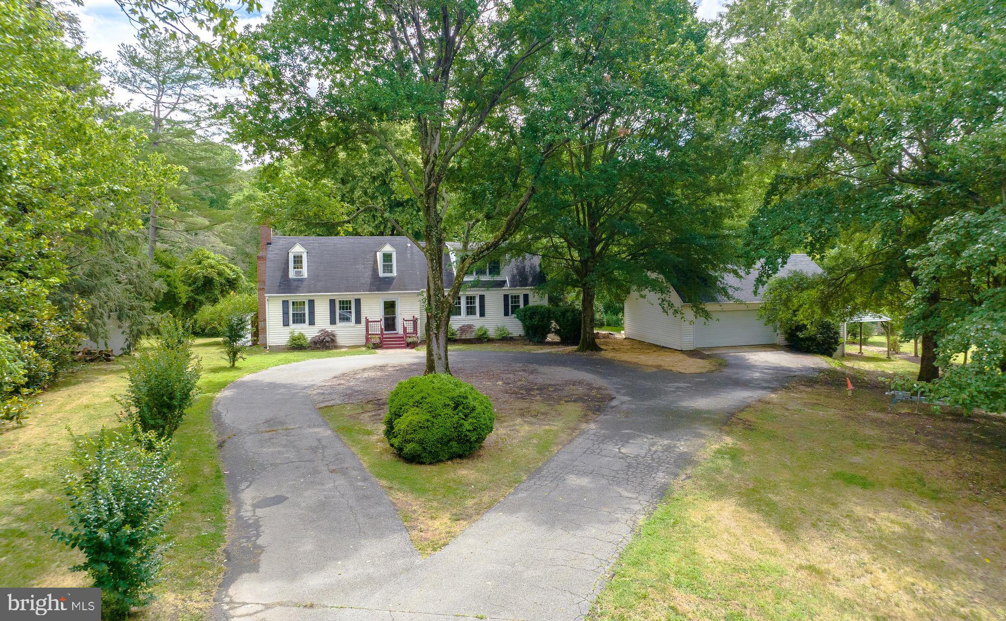 159 West Bay Front Road Lothian, MD 20711 - Photo 2 of 64 a front view of a house with a yard