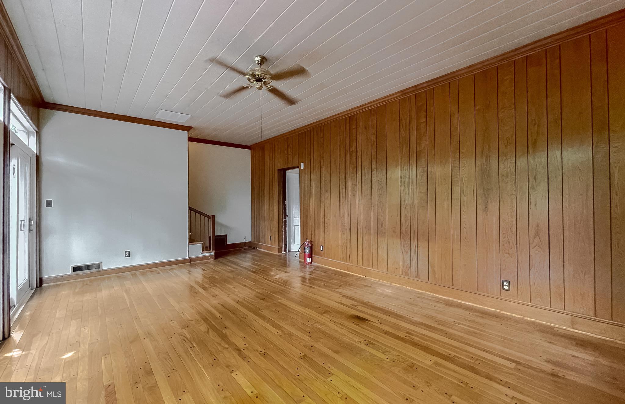 159 West Bay Front Road Lothian, MD 20711 - Photo 33 of 64 a view of an empty room with wooden floor