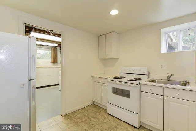 a kitchen with a stove and a refrigerator