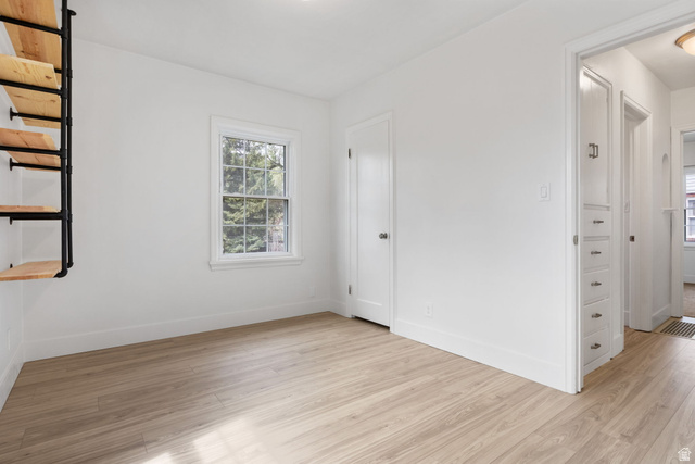 141 South 400 East Logan, UT 84321 - Photo 19 of 41 Unfurnished bedroom featuring light wood-style floors and baseboards
