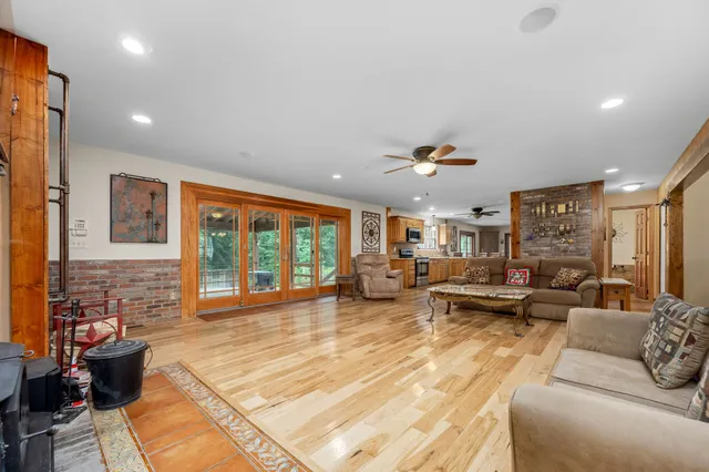 a bathroom with a granite countertop toilet sink and mirror